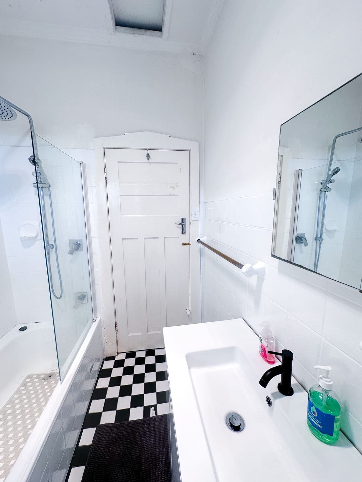 Downstairs bathroom, white vanity and mirror