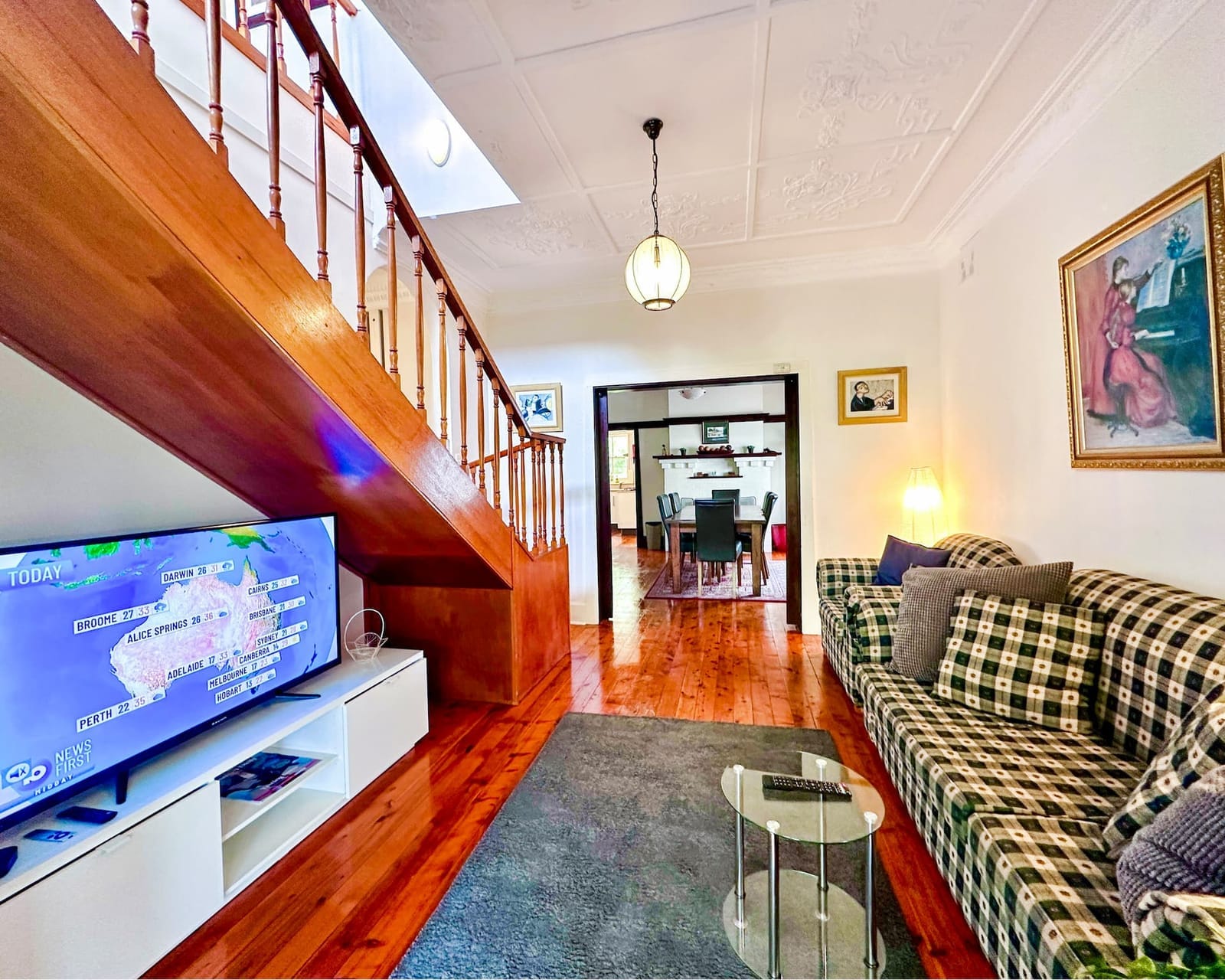 Downstairs lounge, wicker chairs and a view over the water